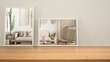 © ArchiVIZ - Minimalist mirrors on wooden table, desk or shelf reflecting interior design scene. Vintage living room with fabric sofa, rattan armchair and decors. Modern background with copy space