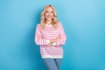 Poster - Photo of funny adorable woman wear striped sweater smiling arms crossed isolated blue color background