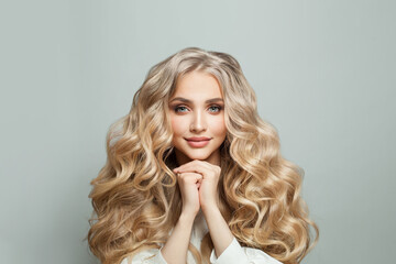 Wall Mural - beautiful face close up. healthy female model portrait. cute young woman with long curly hair and na