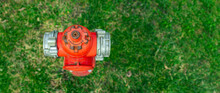 Banner,advertisement.Single Red Fire Hydrant On Green Lawn.Autumn,spring,summer Day.Copy Space.Top View.Panoramic View.