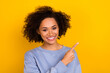 © deagreez - Photo of pretty adorable wavy lady wear blue sweatshirt pointing empty space isolated yellow color background