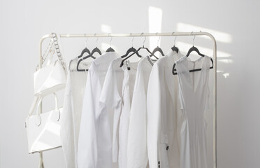 Canvas Print - female white capsule summer wardrobe in  white room