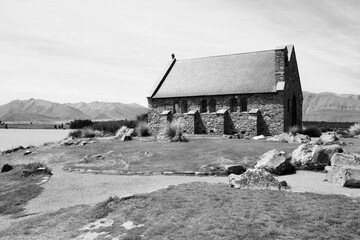 Sticker - Lake Tekapo chapel in New Zealand. Black and white retro photo style.