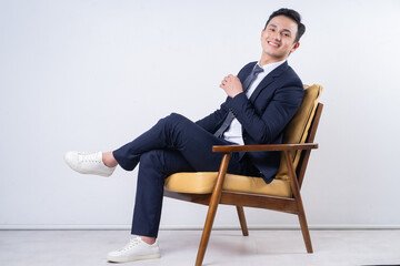 Poster - Image of young Asian businessman on background