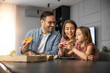 © ivanko80 - Happy family sharing pizza together at home
