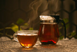 Fototapeta Mapy - Hot black tea on a dark background 
