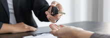 Car Salesman Gave The Keys To The Customers Who Signed The Purchase Contract Legally, Successful Completion Of Car Sales, Purchase Contract And Key Delivery.