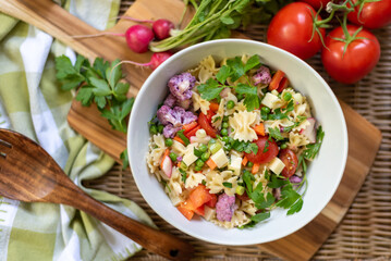 Top view of homemade pasta salad and fresh ingredients