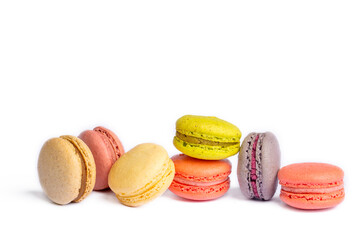 Wall Mural - Colorful macaroon cakes. Small french muffins. Colorful macarons on a white background