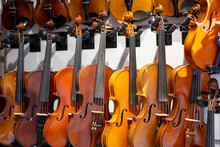 Showcase With Violins In Music Store