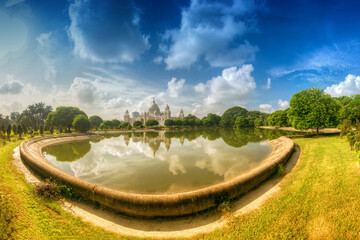 Wall Mural - Beautiful panoramic image of Victoria Memorial, Kolkata , Calcutta, West Bengal, India . A Historical Monument of Indian Architecture. Huge lake in foregreound, stock image.