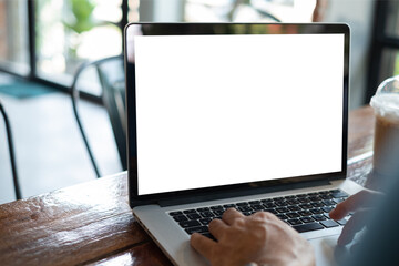 Wall Mural - man using laptop computer working at home with blank white desktop screen. with clipping paths.