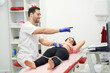 © Retamosa - a physiotherapist performing an ultrasound scan for pelvic floor treatment