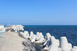 The blue sea under the blue sky as seen from the breakwater on a fine day. horizon