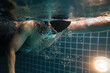 © torwaiphoto - Man swimming pool.Underwater photo..