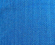 Pattern Of Blue Fabric Close-up With Triangular Shaped Stitching