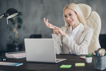 Sticker - Portrait of attractive positive business lady sitting chair speak communicate webcam hand fingers count workplace indoors