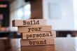 © Uuganbayar - Wooden blocks with words 'Build your personal brand'. Business concept