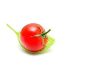 Cocktail Tomato On A Fresh Basil Leaf