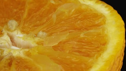 Wall Mural - 4K Macro shot of navel orange fruit and rotate.Close up fresh citrus orange  background 4K UHD video