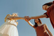 © Luana - GIRLS HOLDING THEIR HANDS. VIEW FROM BELOW.