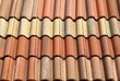 Set of composite roof tiles with yellow, brown and red colors. Background and texture