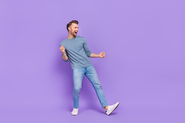 Sticker - Photo of cool impressed guy dressed grey shirt dancing looking empty space isolated purple color background