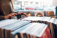 Woman Hands Choosing Vinyl Record In Music Record Shop