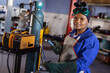 © Wavebreak Media - Portrait of confident smiling mid adult african american female welder working in workshop