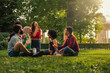 Leinwandbild Motiv Small group having picnic at park