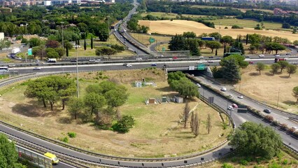 Wall Mural - Aerial view of the Great Ring Junction in Rome, Italy. It's a long orbital motorway that encircles the city.