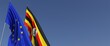 Flags of the European Union and Uganda on flagpoles on side. Flags on a blue background. Place for text. EU. Ugandan. 3d illustration.