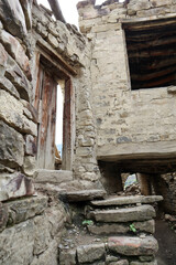 Wall Mural - details of old ruined stone houses on the street in abandoned mountain village Old Koroda in Dagestan, Russia