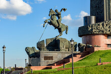 Statue Of Saint George Killing The Serpent At Foot Of Victory Obelisk On Poklonnaya Mountain, Moscow, Russia