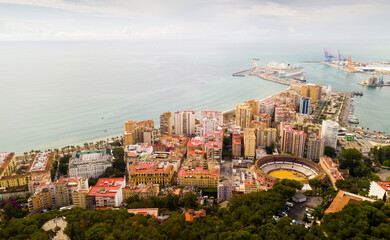 Canvas Print - Panoramic view of Mediterranean coastal city of Malaga with harbor, Spain