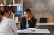 © David - Cropped shot of Asian Business woman diverse coworkers working together in the boardroom, brainstorming, discussing, and analyzing business report strategy collaboration.