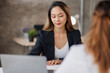 © David - Cropped shot of Asian Business woman diverse coworkers working together in the boardroom, brainstorming, discussing, and analyzing business report strategy collaboration.