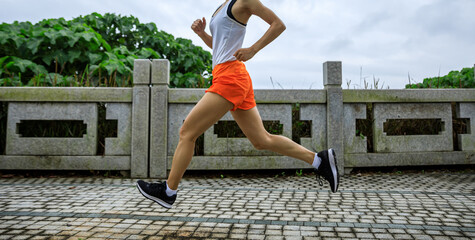 Poster - Fitness woman runner running at seaside