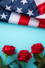 Wall Mural - Concept of Independence day or Memorial day. American Flag over blue table background with red rose.