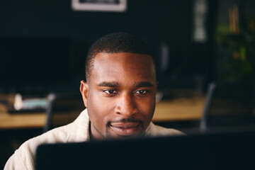 Young Black Male Advertising Marketing Or Design Creative In Office Sitting At Desk Working On Computer