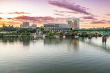 Fototapeta  - The city skyline of Knoxville along the Tennessee River at sunset
