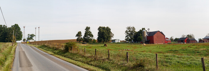 Wall Mural - Amish farm with a red barn beside a country road | Kansas Road - Holmes County, Ohio