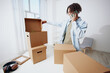 © SHOTPRIME STUDIO - portrait of a man with a phone in hand with boxes moving Lifestyle