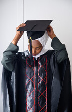 Muslim Student Adjusting Her Graduation Cap