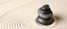 Stack Of Stones On Sand With Lines. Zen Concept