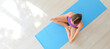 © Pixel-Shot - Young woman practicing yoga at home, top view. Zen concept