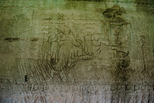 The Sandstone Wall Carvings Tell The Story Of The Army And War On The Walls Of Angkor Wat Siem Reap, Cambodia.