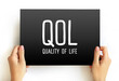 QOL Quality of life - degree to which an individual is healthy, comfortable, and able to participate in or enjoy life events, acronym concept on card