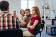 © bnenin - Concentrated people sitting and listening to others, during the group mental health therapy.