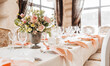 Luxury table setting for dining in a restaurant in pastel colors close up. Wedding party table set for banquet
